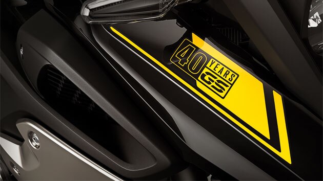 We see a close-up of the 40 Years GS sticker.