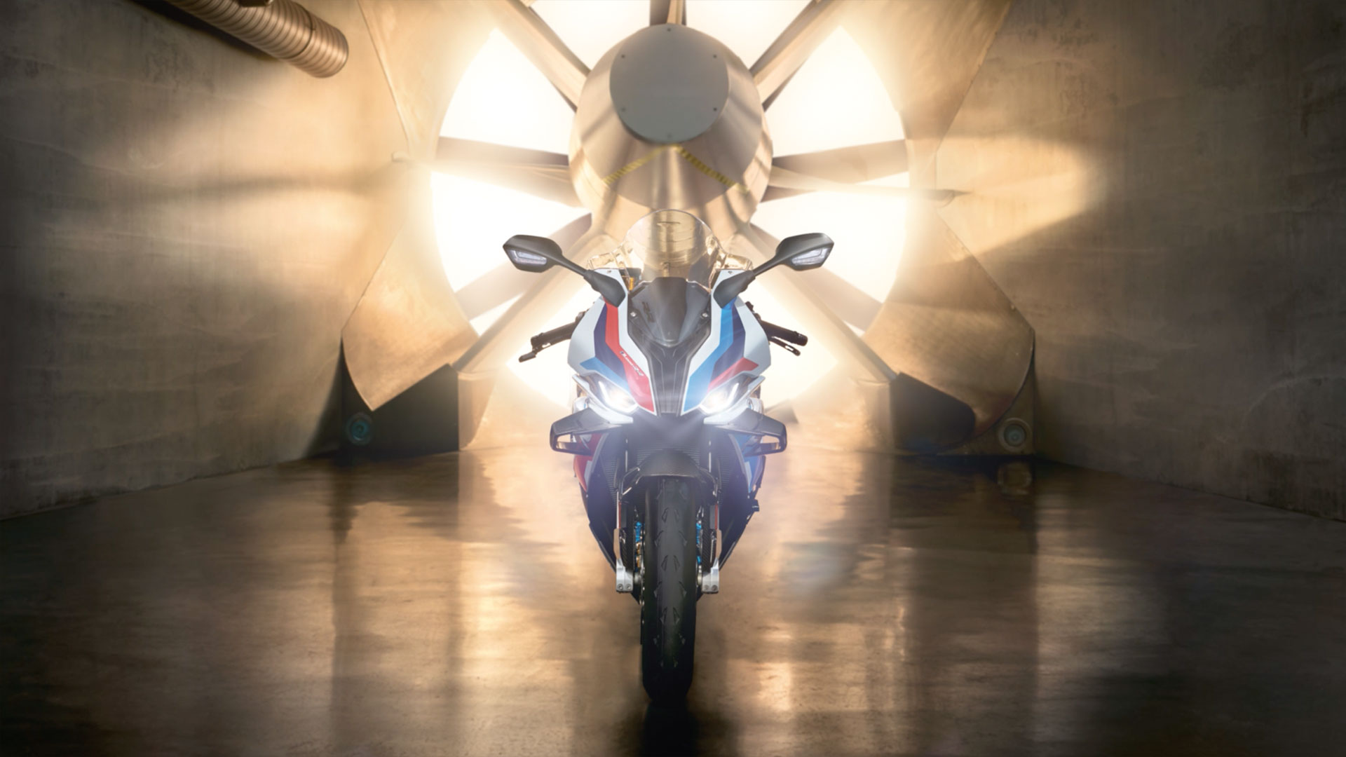 We see the M RR in front of a rotating turbine when the sun is shining.